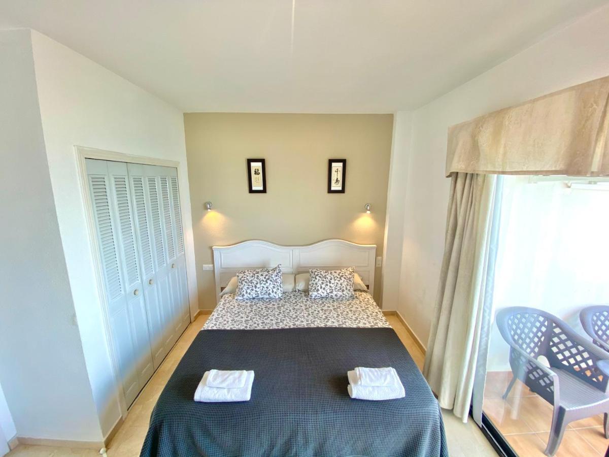 Apartamentos Turisticos Castillo Del Vigia 托雷莫利诺斯 外观 照片